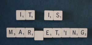 an image of letter tiles spelling out "it is marketing"